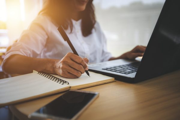 young woman  with learning language during online courses using netbook